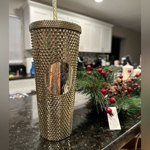 Gold Starbucks holiday cup for 2022.